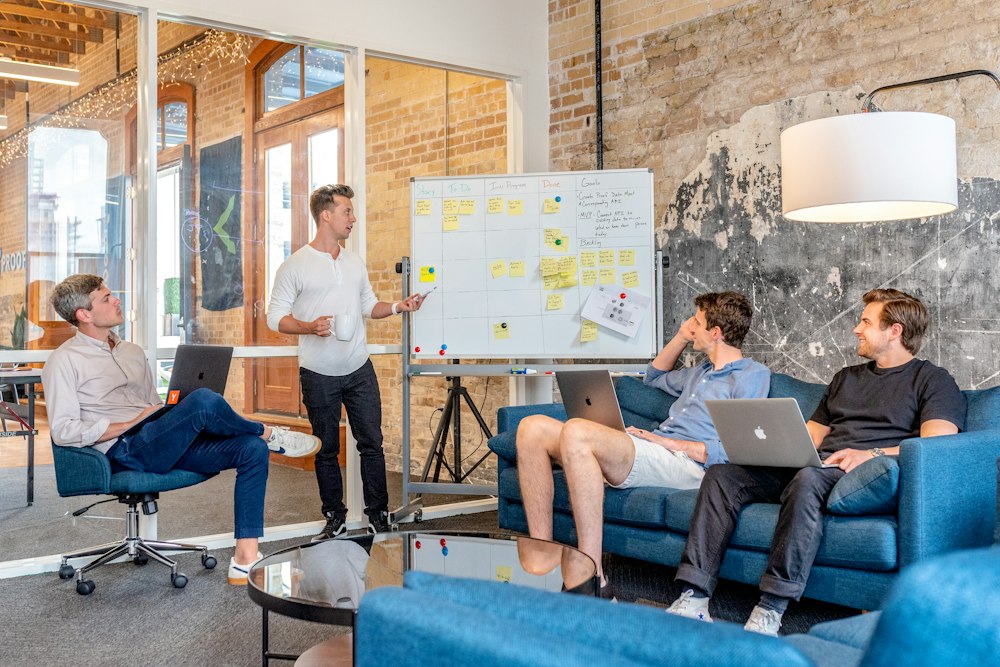 Trainer leading a team workshop at a whiteboard