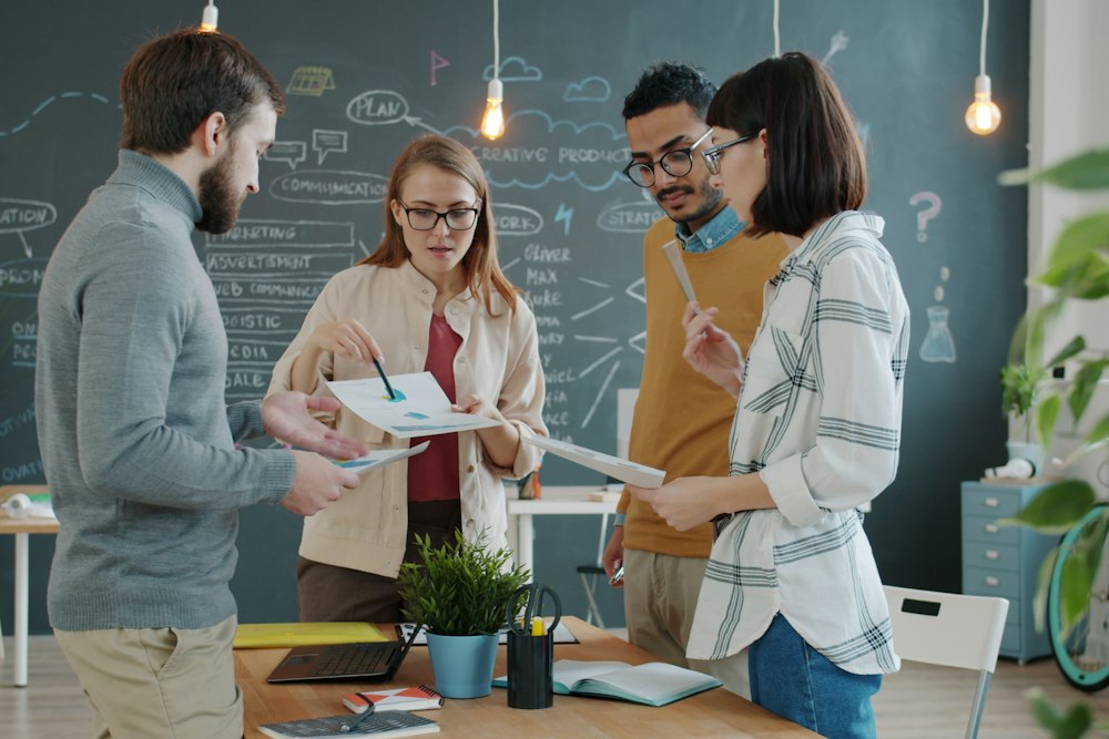 Diverse team discussing work together in an office